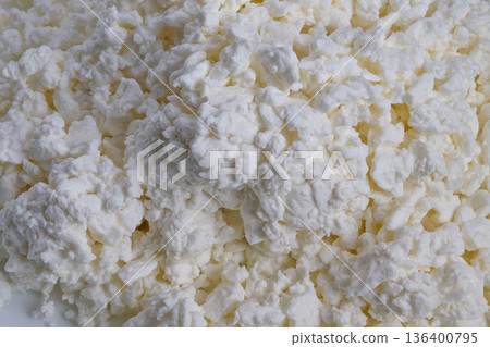 Creamy cottage cheese lumps for breakfast, proteinrich ingredient, spoonready curds, bright natural lighting, healthy eating concept, salad and smoothie topping inspiration 136400795