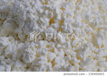 Macro cottage cheese texture pattern, repetitive lumpy curds forming abstract landscape, soft shadows and neutral tones, perfect for backgrounds, packaging, culinary art Macro cottage cheese texture pattern, repetitive lumpy curds forming abstract landscape, soft shadows and neutral tones, perfect for backgrounds, packaging, culinary art 136400801