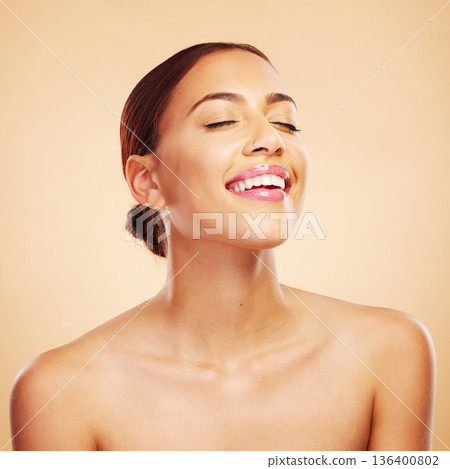 Skincare, beauty and happy woman with eyes closed in studio isolated on a brown background. Face, makeup cosmetics and natural model with spa facial treatment for aesthetic, wellness and healthy skin 136400802