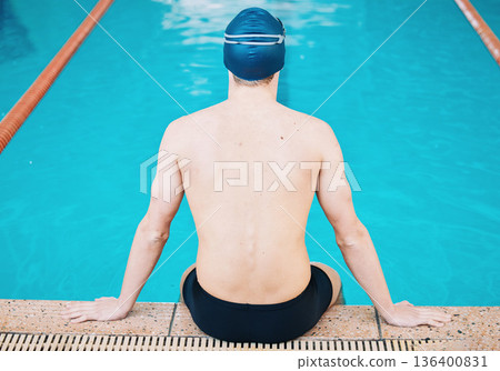 Swimming, sports and man in pool for training, competition and exercise in water. Professional swimmer, fitness and back of male person practice for challenge, workout and performance for wellness 136400831