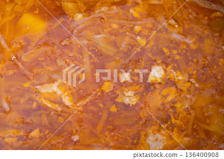 Classic soup preparation, Simmered cabbage soup with spices and root vegetables, Comforting homemade cabbage and root vegetable stew infused with aromatic spices and herbs Classic soup preparation, Simmered cabbage soup with spices and root vegetables, Comforting homemade cabbage and root vegetable stew infused with aromatic spices and herbs 136400908
