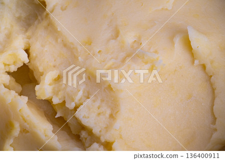 Creamy potato presentation, Closeup showing fluffy mashed potatoes with glossy butter glaze, Detailed view of creamy whipped potatoes with golden butter and fine texture Creamy potato presentation, Closeup showing fluffy mashed potatoes with glossy butter glaze, Detailed view of creamy whipped potatoes with golden butter and fine texture 136400911