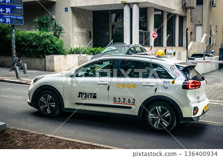 Tel Aviv, Israel, January 3, 2026 Taxis navigate the busy streets of downtown Tel Aviv, maintaining the city mobility and flow despite the ongoing regional conflict and heightened security tensions. Tel Aviv, Israel, January 3, 2026 Taxis navigate the busy streets of downtown Tel Aviv, maintaining the city mobility and flow despite the ongoing regional conflict and heightened security tensions. 136400934