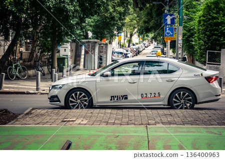 Tel Aviv, Israel, January 3, 2026 Taxis navigate the busy streets of downtown Tel Aviv, maintaining the city mobility and flow despite the ongoing regional conflict and heightened security tensions. 136400963