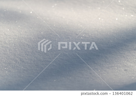 Snowy winter landscape, Sparkling snow with blue shadows, Icecovered snow reflecting cool blue light, Glittering snowfield under clear sky with icy shadows and crystals Snowy winter landscape, Sparkling snow with blue shadows, Icecovered snow reflecting cool blue light, Glittering snowfield under clear sky with icy shadows and crystals 136401062