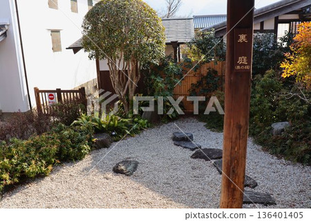 A tranquil Japanese garden with stepping stones A tranquil Japanese garden with stepping stones 136401405