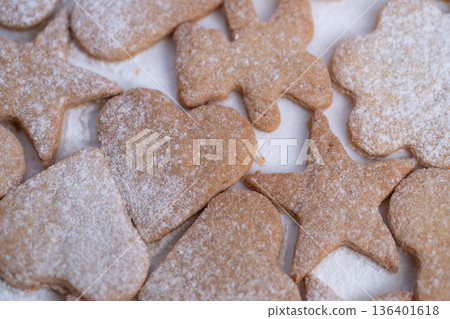 Family joyful moments with baked cookies, Reminiscent of home baking and childhood happiness, Charming display of festive cookies evoking warm family holiday traditions 136401618