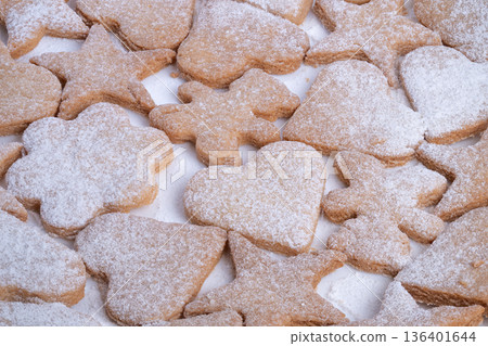 Decorative cookies with sugar dusting, Cookies featuring hearts and stars with powdered sugar, Delicious homemade cookies with decorated heart and star shapes dusted with powder Decorative cookies with sugar dusting, Cookies featuring hearts and stars with powdered sugar, Delicious homemade cookies with decorated heart and star shapes dusted with powder 136401644