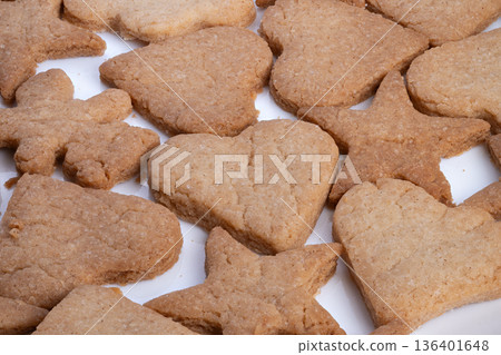 Flat lay of seasonally themed cookies prepared for gifting and display, Small batch sugar cookies with golden accents arranged to enhance romantic gift presentation Flat lay of seasonally themed cookies prepared for gifting and display, Small batch sugar cookies with golden accents arranged to enhance romantic gift presentation 136401648