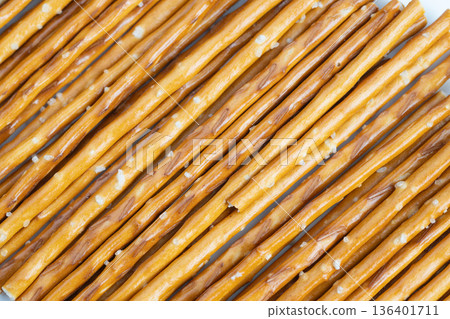 Crunchy pretzels boost activity energy. Salted pretzel sticks serve energetic snack needs. Trailready pretzels deliver robust crunch and visible salt for energetic pursuits 136401711