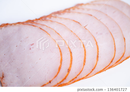 Basic photograph of ham pieces with neutral lighting backdrop. Minimalist photograph showcasing ham segments isolated against plain white background suitable for menu design Basic photograph of ham pieces with neutral lighting backdrop. Minimalist photograph showcasing ham segments isolated against plain white background suitable for menu design 136401727