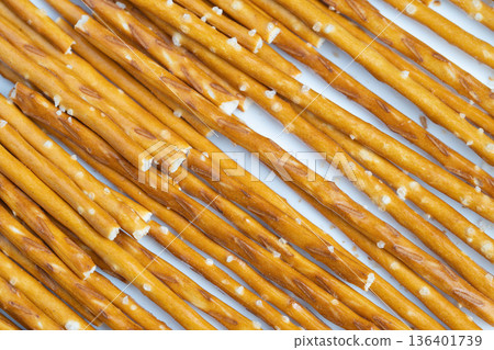 Casual finger food with crunchy texture and inviting appearance. Prepared salted snack sticks designed for easy sharing during casual social events and celebrations Casual finger food with crunchy texture and inviting appearance. Prepared salted snack sticks designed for easy sharing during casual social events and celebrations 136401739