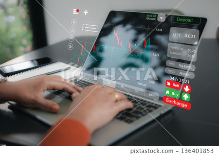 Close up of businesswoman hands using laptop with digital stock market trading graph and financial investment exchange icons, forex analysis, and money management concept. Close up of businesswoman hands using laptop with digital stock market trading graph and financial investment exchange icons, forex analysis, and money management concept. 136401853