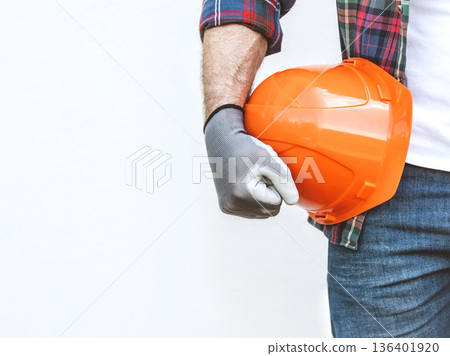 Handsome man in work clothes and hardhat. Studio shot. 136401920
