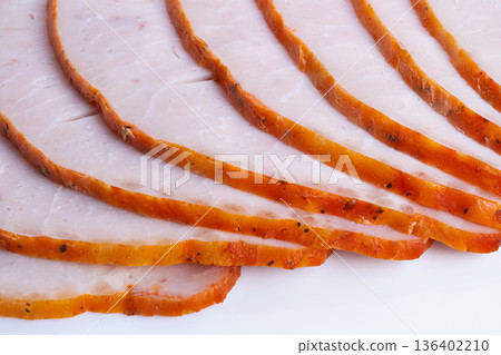 Warm slices served warmly today. Sliced roast with comforting breakfast appeal. Prepared thin roast slices presented attractively as quick homestyle breakfast option 136402210