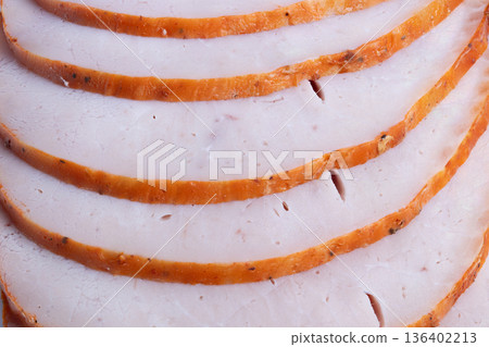 Roasted poultry with golden crust. Highprotein turkey breast slices for packaging. Detailed image of moist smoked turkey breast with subtle knife cuts and golden rind Roasted poultry with golden crust. Highprotein turkey breast slices for packaging. Detailed image of moist smoked turkey breast with subtle knife cuts and golden rind 136402213