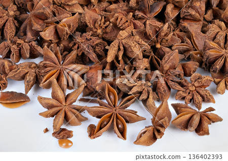 Seasonal spices arranged for cozy holiday baking and marketing content. Scenario depicting baker preparing mulled drinks and cookies with aromatic spices and holiday ambiance 136402393