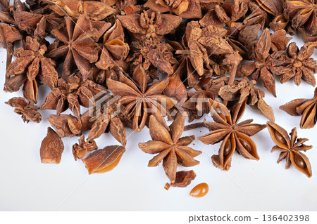 Simple star anise. Clean white background with spice. Minimalist star anise dish on white background. White backdrop featuring single star anise with negative space 136402398