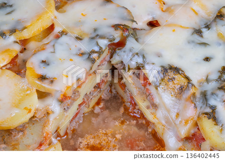 Macro texture potato pizza hero highlighting melting cheese threads and glossy oil pools, crisp edges and gooey interior, packaging ready advertising composition Macro texture potato pizza hero highlighting melting cheese threads and glossy oil pools, crisp edges and gooey interior, packaging ready advertising composition 136402445