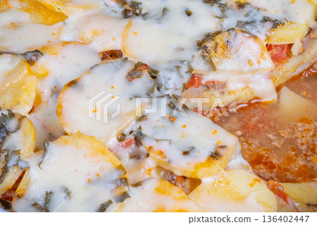 Organic potato and herb tart. Handcrafted crust with seasonal herb toppings. Elegant farm to table pizza showcasing seasonal herbs and carefully selected organic potatoes 136402447