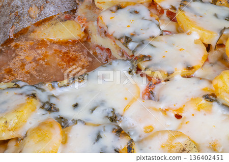 Homestyle oven baked potato pizza emitting warm steam, layered potatoes under bubbling cheese, slice missing from pan, cozy kitchen vibe, communal dinner feeling Homestyle oven baked potato pizza emitting warm steam, layered potatoes under bubbling cheese, slice missing from pan, cozy kitchen vibe, communal dinner feeling 136402451