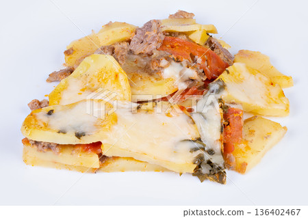 Savory cheesy casserole. Hearty baked meat and potatoes. Warm cheesy meat and potato bake dish. Delicious layered casserole with melted cheese and seasoned meats 136402467