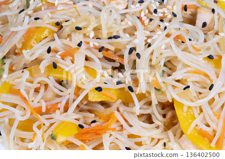 Precooked vermicelli with chicken vegetables and sesame topping. Readily available portioned vermicelli with chicken and vegetables topped with sesame for ease and health Precooked vermicelli with chicken vegetables and sesame topping. Readily available portioned vermicelli with chicken and vegetables topped with sesame for ease and health 136402500