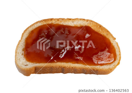Toast with jam spread glossy, bright red berry jam pooled on golden surface, sticky shine creates appetizing contrast, playful snack moment for breakfast or kids 136402563