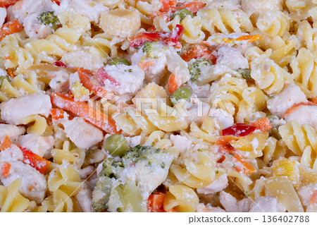 Colorful fusilli with fresh vegetables. Creamy pasta combined with vibrant vegetable mix. Chilled pasta salad featuring diverse colorful vegetables and smooth dressing Colorful fusilli with fresh vegetables. Creamy pasta combined with vibrant vegetable mix. Chilled pasta salad featuring diverse colorful vegetables and smooth dressing 136402788