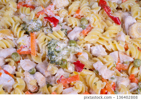 Creamy fusilli ready for office lunch takeaway container fork quick comfort chilled or warmed sliced peppers peas carrot midday energy boost office worker reheating Creamy fusilli ready for office lunch takeaway container fork quick comfort chilled or warmed sliced peppers peas carrot midday energy boost office worker reheating 136402808