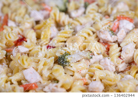 Exquisite fusilli pasta with microgreens and cheese garnish. Sophisticated presentation of gourmet fusilli pasta with microgreens and grated cheese for catering showcase Exquisite fusilli pasta with microgreens and cheese garnish. Sophisticated presentation of gourmet fusilli pasta with microgreens and grated cheese for catering showcase 136402944