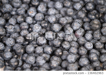 Dense blueberry texture creating background, muted indigo palette and organic shapes form abstract visual for packaging, web hero, and social media texture overlays Dense blueberry texture creating background, muted indigo palette and organic shapes form abstract visual for packaging, web hero, and social media texture overlays 136402963