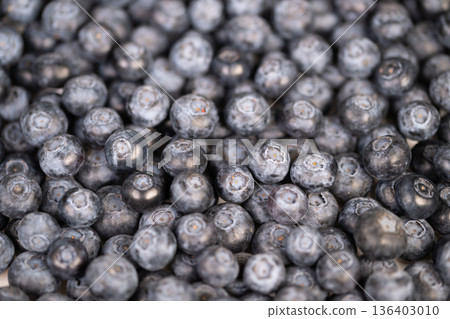 Farm produce showcase. Rustic farm berries presented beautifully. Vintage crates hold artisan blueberries in display. Freshly picked berries arranged on rustic crates for display 136403010