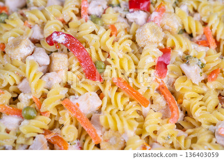Vibrant vegetable fusilli image. Bright pasta with vegetables for designs. Vivid fusilli pasta mixed with vegetables suitable for food packaging and design visuals Vibrant vegetable fusilli image. Bright pasta with vegetables for designs. Vivid fusilli pasta mixed with vegetables suitable for food packaging and design visuals 136403059