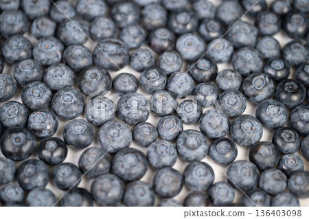 Smooth blueberry background perfect for packaging and branding design. Uniform blueberry texture with vibrant blue shades suitable for product packaging and visual branding Smooth blueberry background perfect for packaging and branding design. Uniform blueberry texture with vibrant blue shades suitable for product packaging and visual branding 136403098