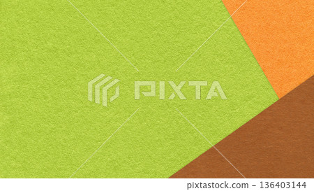 Green textured paper background with orange brown triangular corners and copy space. Template for presentation, banner 136403144