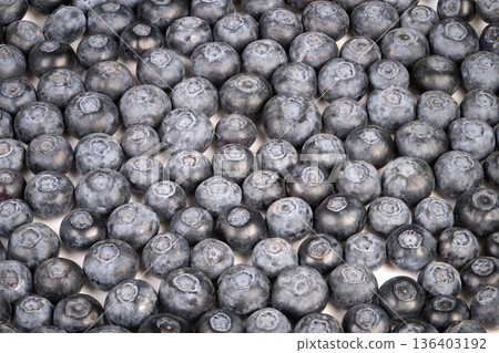 Seasonal blueberries neatly packed in traditional countryside style crate. Locally harvested blueberries displayed in countrythemed crate for sale or presentation Seasonal blueberries neatly packed in traditional countryside style crate. Locally harvested blueberries displayed in countrythemed crate for sale or presentation 136403192