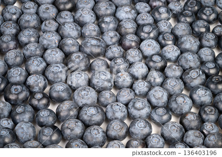Gourmet blueberries with artistic lighting. Photograph of styled blueberries highlighting rich textures. Culinary styled blueberries captured with matte lighting and vibrant hues Gourmet blueberries with artistic lighting. Photograph of styled blueberries highlighting rich textures. Culinary styled blueberries captured with matte lighting and vibrant hues 136403196