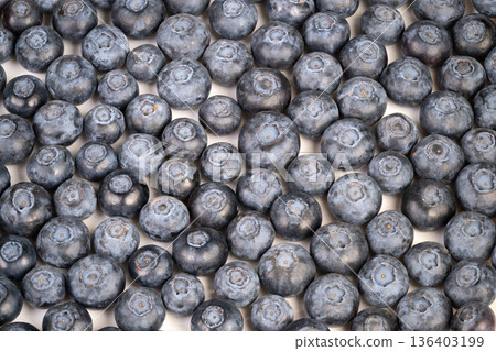 Blueberries breakfast ambiance. Juicy blueberries evoke calm breakfast smoothie vibe. Colorful clusters of blueberries generate vibrant and soothing breakfast environment 136403199