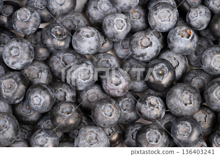 Closeup blueberries pastry chef mise en place, stylingready fruit, dewy bloom details, ideal for tarts and galettes, warm studio light, culinary prep atmosphere 136403241