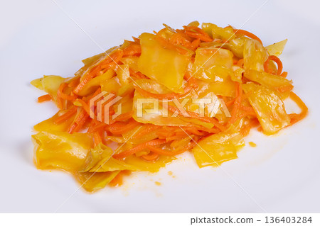 Macro image highlighting shredded fermented vegetables with dressing. Upclose photograph emphasizing micro details and textures of fermented carrots and cabbage Macro image highlighting shredded fermented vegetables with dressing. Upclose photograph emphasizing micro details and textures of fermented carrots and cabbage 136403284