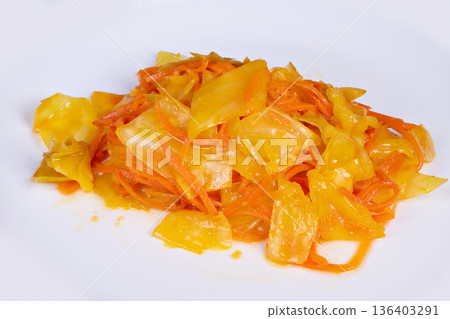 Vivid pickled vegetables. Tangy fermented vegetables highlighted in closeup photography. Brightly colored pickled cabbage and carrots with glossy sesame oil coating Vivid pickled vegetables. Tangy fermented vegetables highlighted in closeup photography. Brightly colored pickled cabbage and carrots with glossy sesame oil coating 136403291