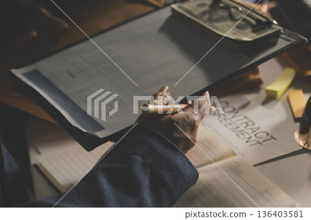 Businesswoman and Male lawyer or judge consult and conference having team meeting with client at law firm in office, Law and Legal services concept 136403581