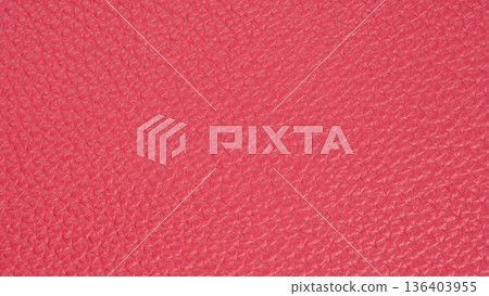Vibrant pink leather texture enveloped in light, showcasing intricate patterns and richness of craftsmanship Vibrant pink leather texture enveloped in light, showcasing intricate patterns and richness of craftsmanship 136403955