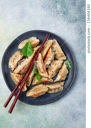 japanese fried dumplings, gyoza, sesame seeds, top view, no people, 136404160