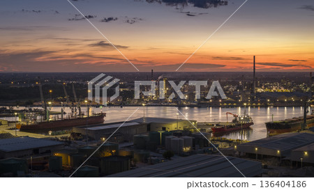 Drone shot showcasing its chemical petrochemical and port industries at night Drone shot showcasing its chemical petrochemical and port industries at night 136404186