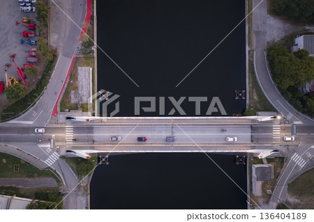 Top down view of a cars driving on a bridge over the canal Top down view of a cars driving on a bridge over the canal 136404189