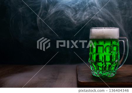 Green beer, hat and clover leaves on grey wooden table. St. Patrick Day celebration Green beer, hat and clover leaves on grey wooden table. St. Patrick Day celebration 136404346