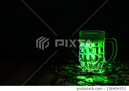 Green beer, hat and clover leaves on grey wooden table. St. Patrick Day celebration Green beer, hat and clover leaves on grey wooden table. St. Patrick Day celebration 136404353