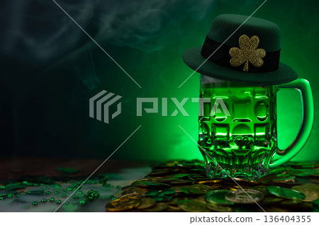 Green beer, hat and clover leaves on grey wooden table. St. Patrick Day celebration Green beer, hat and clover leaves on grey wooden table. St. Patrick Day celebration 136404355